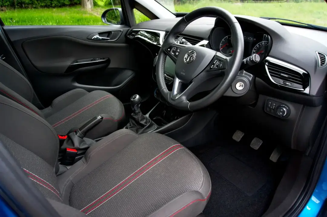 Right-hand-drive car interior with dashboard and steering wheel